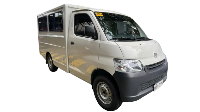 Three-quarter front view of a white Toyota Lite Ace with an aluminum passenger cab and black bumper.
